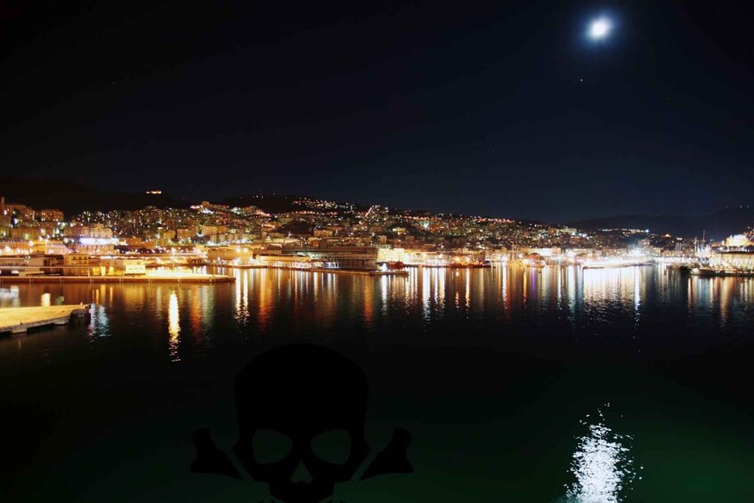 A nighttime cityscape with a body of water reflecting lights, a prominent hill with buildings, and a visible moon. 3