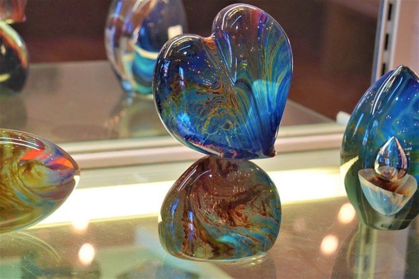Glass art pieces with swirling patterns. 5