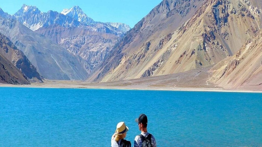 A lake with mountains in the background. 3