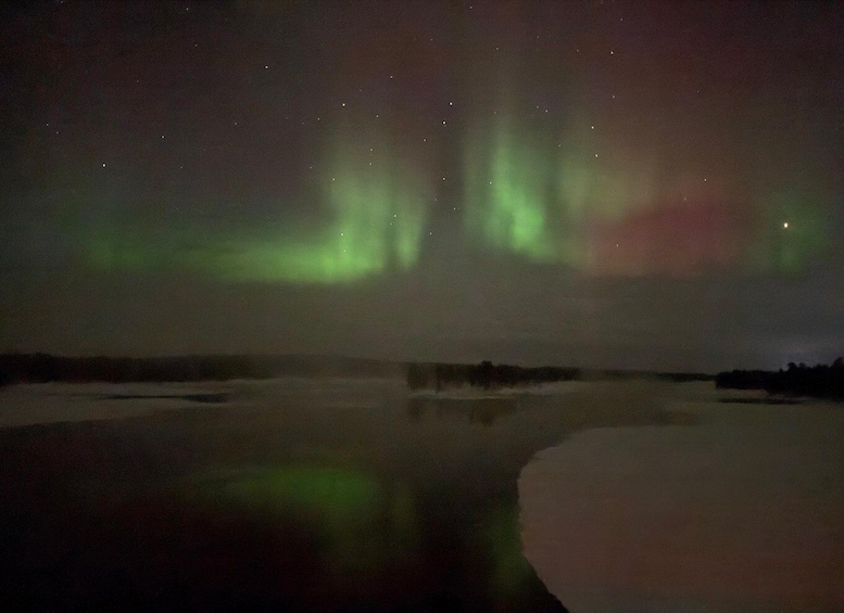 The Northern Lights over a snowy landscape. 5