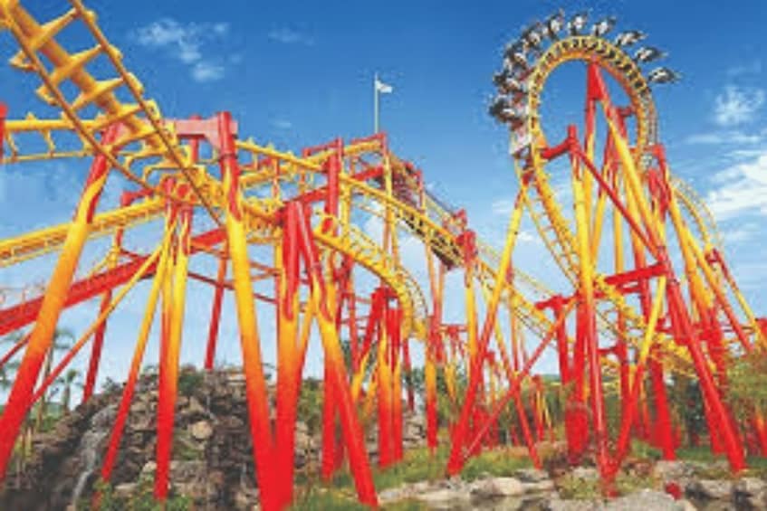 A roller coaster with red and yellow tracks. 2