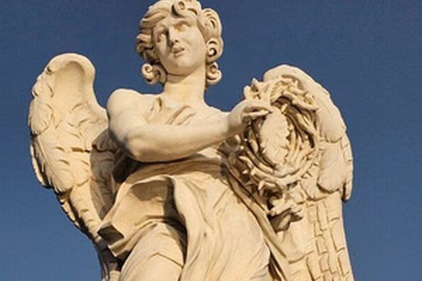 A statue of an angel with wings and a laurel wreath. 5