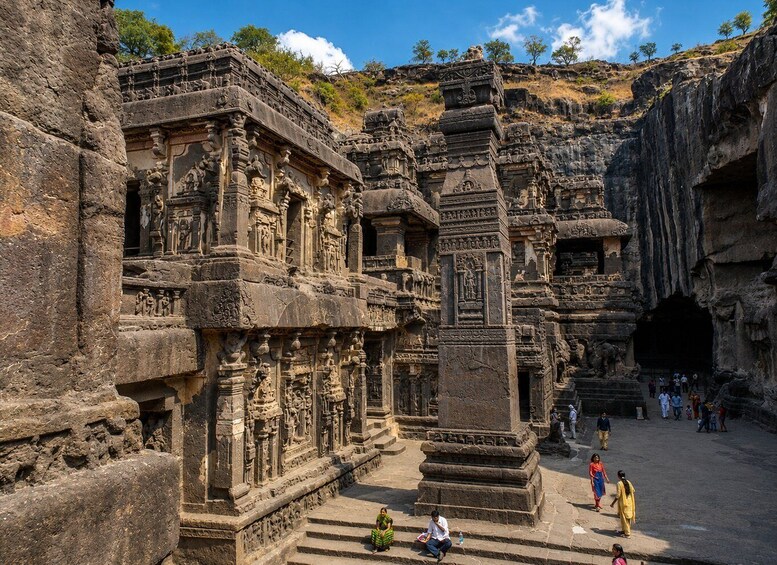 Ancient rock-cut architecture with intricate carvings and a large cave-like structure. 5