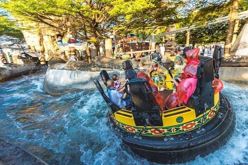 A water ride with people in rafts. 3