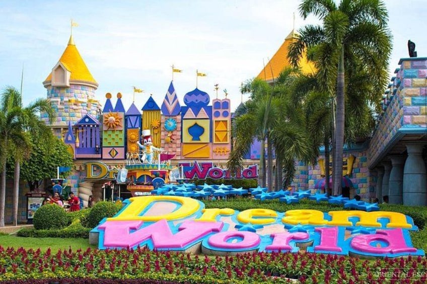 A colorful building with a sign that reads 'Disney World.' 1