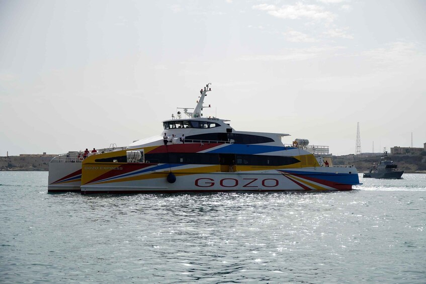 A colorful ferry named GOZO EXPRESS on the water. 5