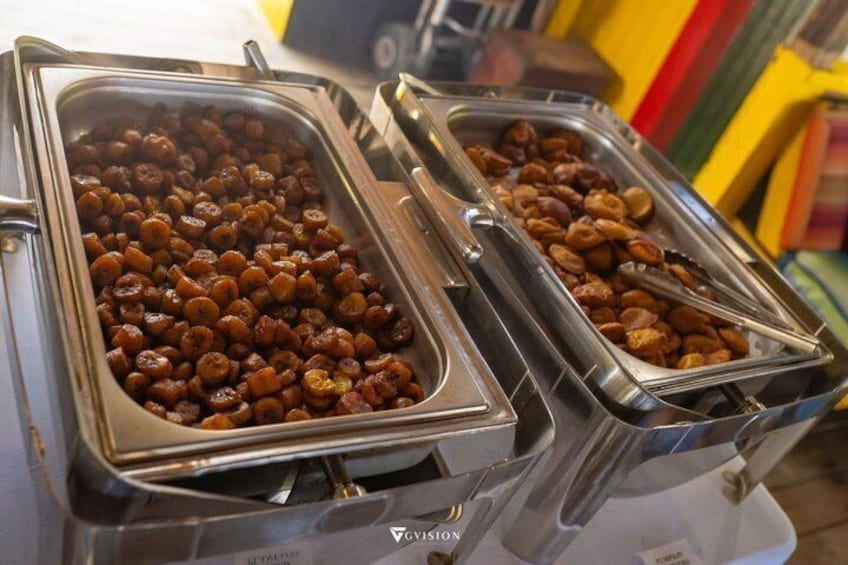 Two buffet trays filled with nuts. 5