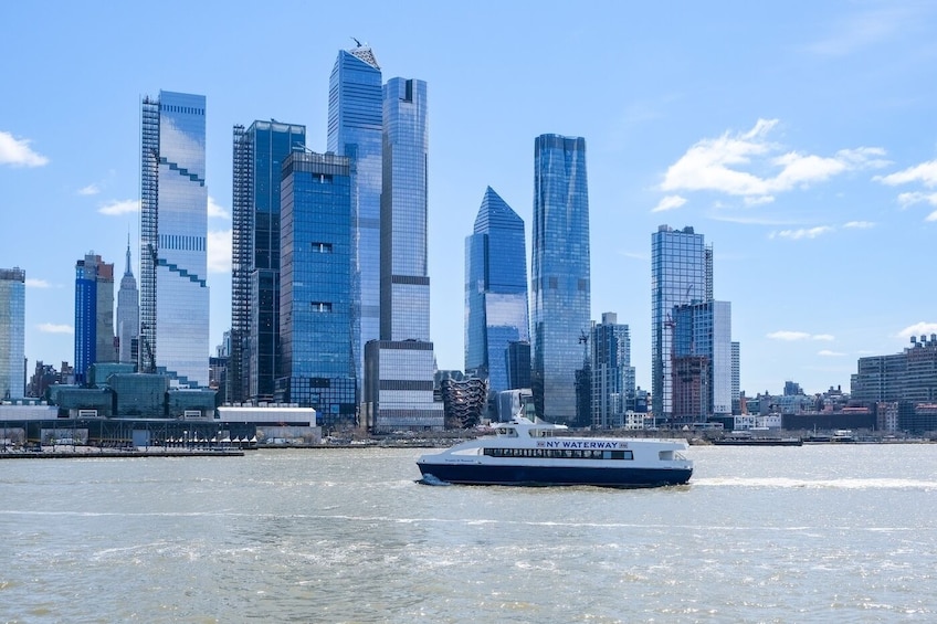 A city skyline with modern skyscrapers and a ferry in the foreground. 2