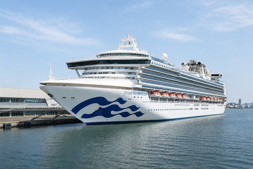 A large cruise ship named Diamond Princess docked at a port. 1