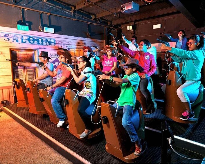 People riding stationary bikes in a room with a sign that reads 'SALON'. 4