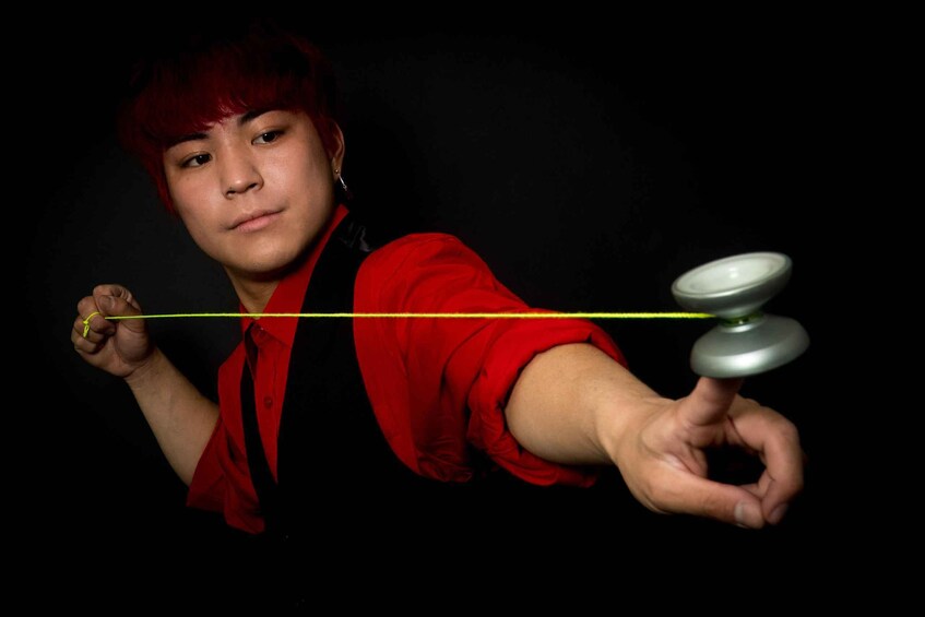 A person performing a yo-yo trick. 5