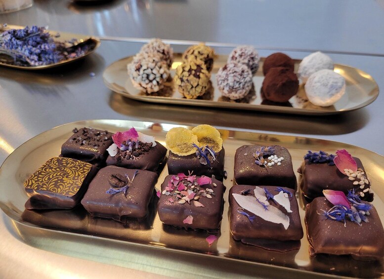 A variety of chocolate desserts on trays. 1