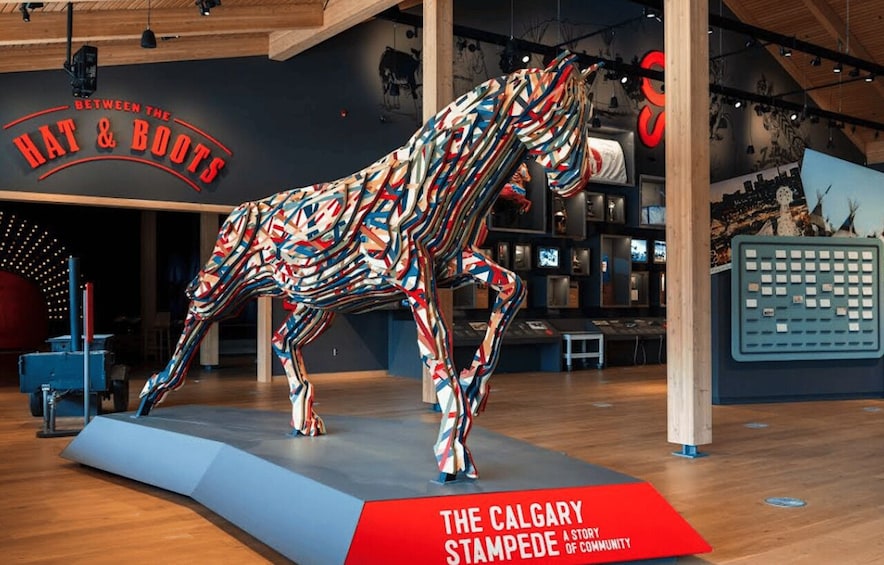 A colorful horse sculpture in a museum. 1