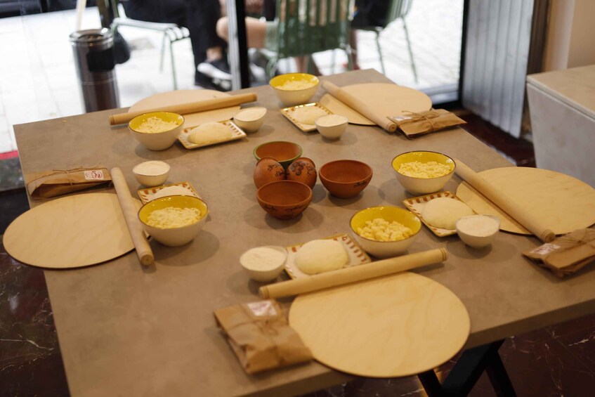 A table with various baking ingredients and utensils. 4