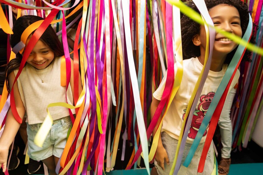 Children playing with colorful streamers. 2