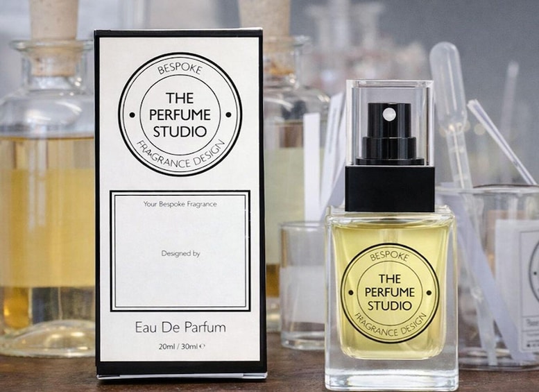 A perfume bottle and its box labeled 'The Perfume Studio' with a fragrance design label. 4