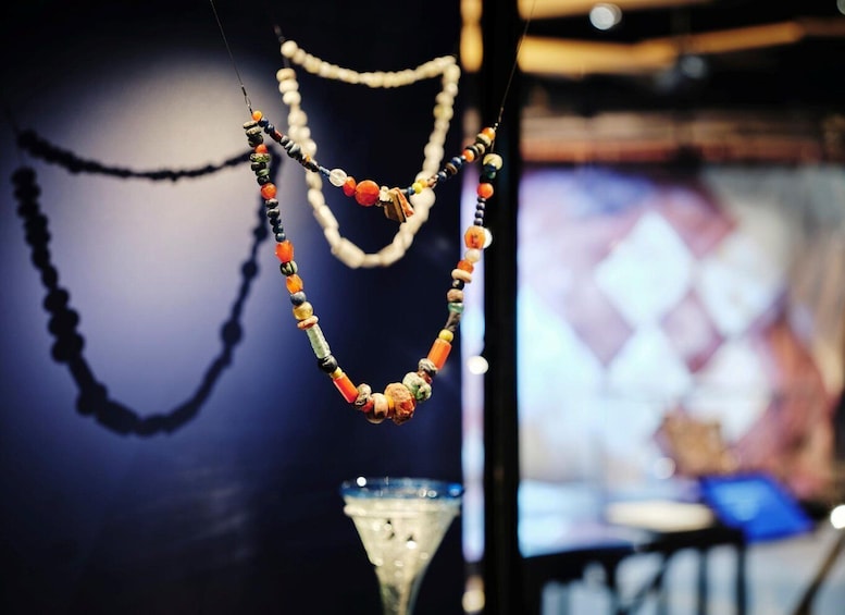 A collection of necklaces with various beads and designs. 4