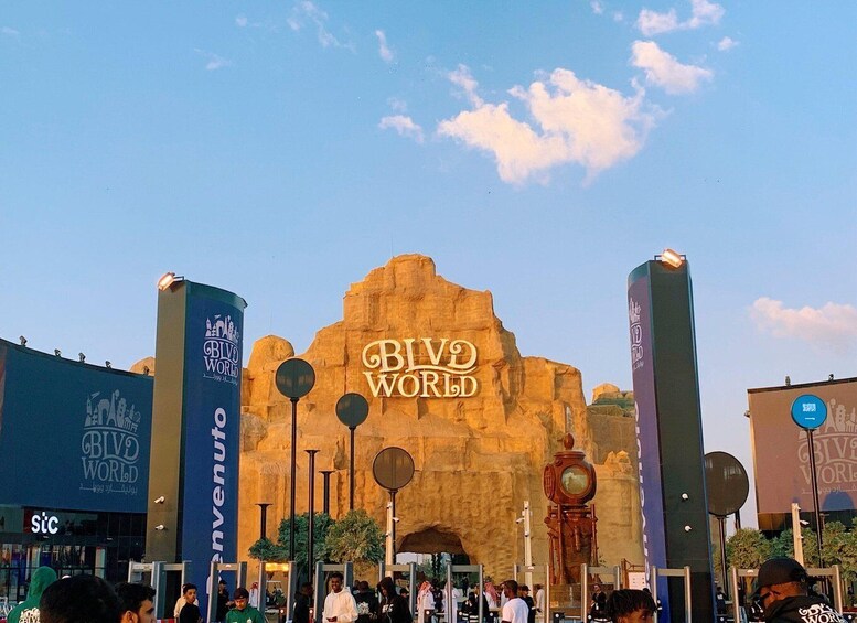 The entrance to BIVE WORLD with a large rock archway and signage. 3