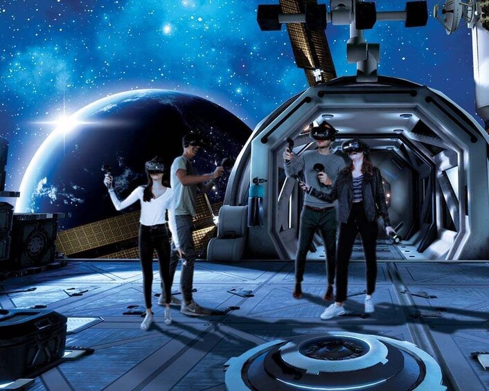 A space station with four people wearing VR headsets. 2
