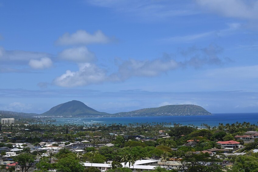 A coastal town with a view of two mountains and the ocean. 3