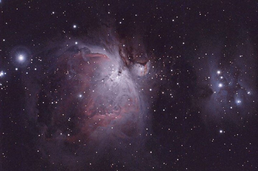 A nebula with bright stars and a central gas cloud. 5