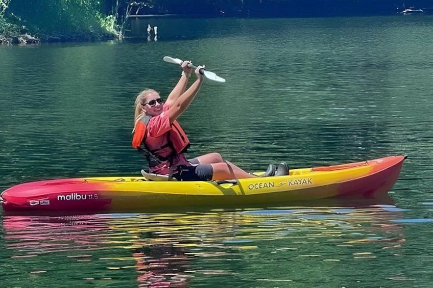 A person kayaking on a lake. 1
