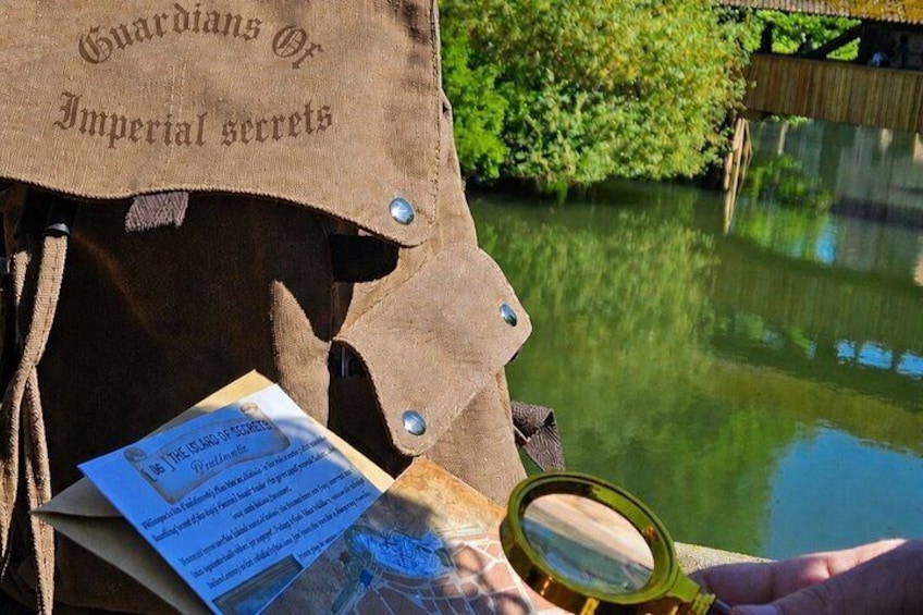 A brown bag labeled 'Guardians of Imperial secrets' with a magnifying glass and a map. 1
