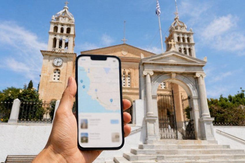 A hand holding a smartphone with a map application, a clock tower, and a classical building with an archway. 1