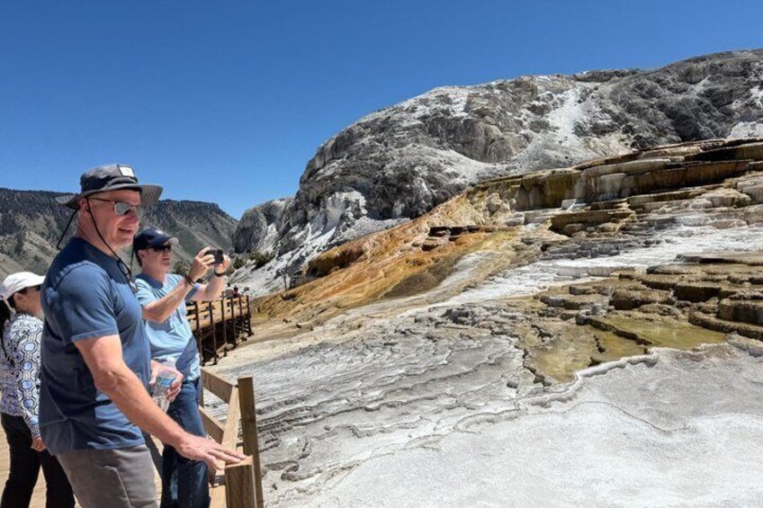 A group of people observing geological formations. 3