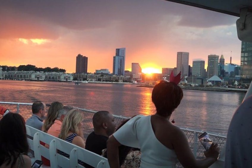 A sunset view of a city skyline from a boat. 3