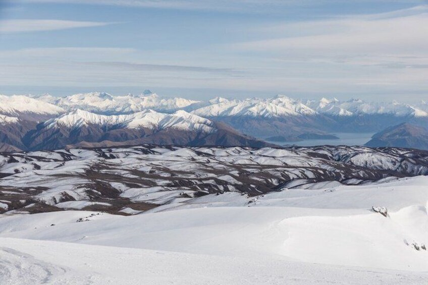 A snow-covered mountain range with a glacier. 1