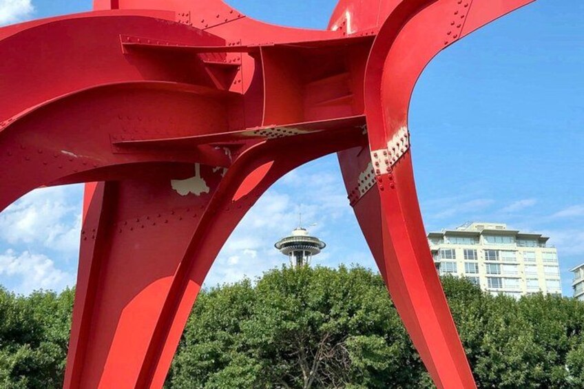 A red metal structure with a tower in the background. 2