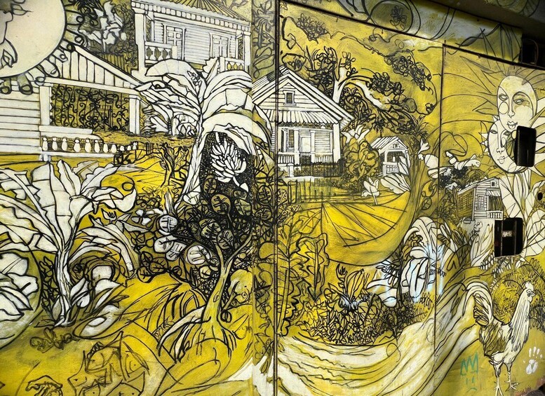A mural with a house, birds, and foliage. 4
