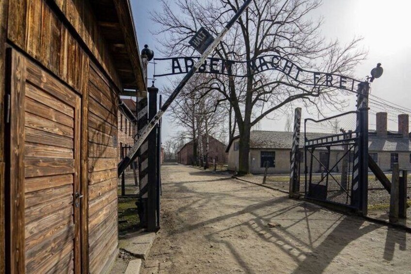 A wooden building with a metal gate labeled 'ABERFELD'. 1