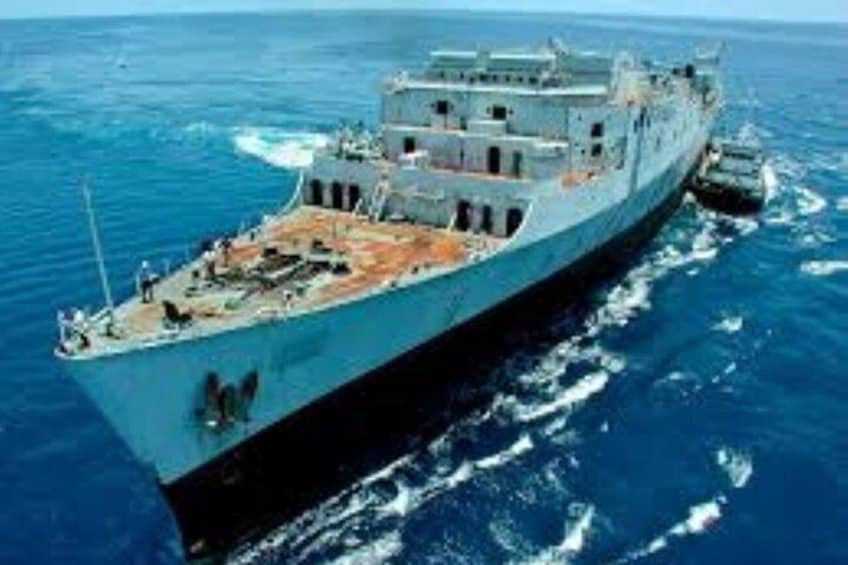 A large naval ship on the ocean. 2