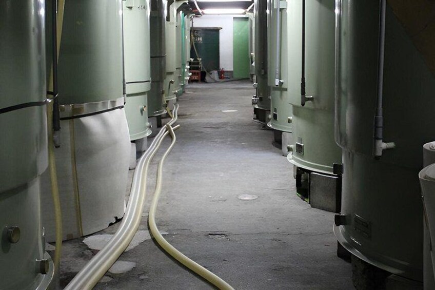 A series of large industrial tanks in a facility. 3
