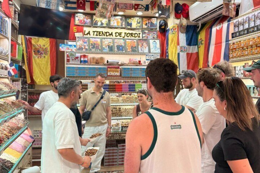 A crowded market with people browsing and shopping. 3