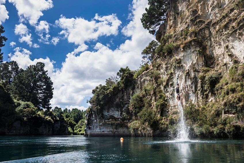 A waterfall, a cliff, and a body of water. 2