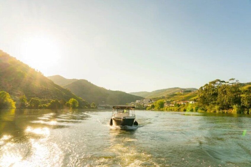 A boat on a river with hills in the background. 5