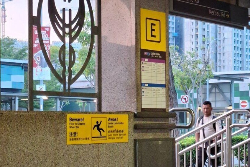 A warning sign, a staircase, and a building facade with a window. 5