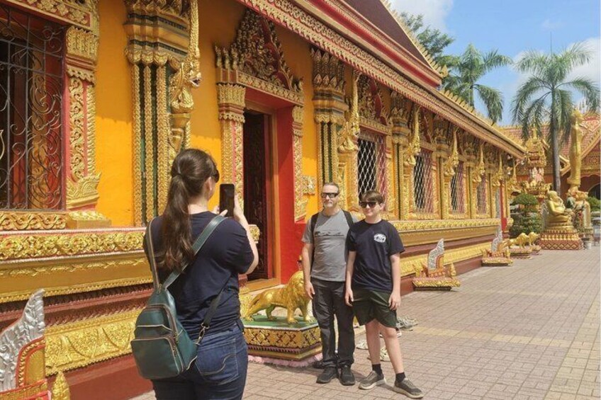 A temple with ornate golden decorations and a red door. 5