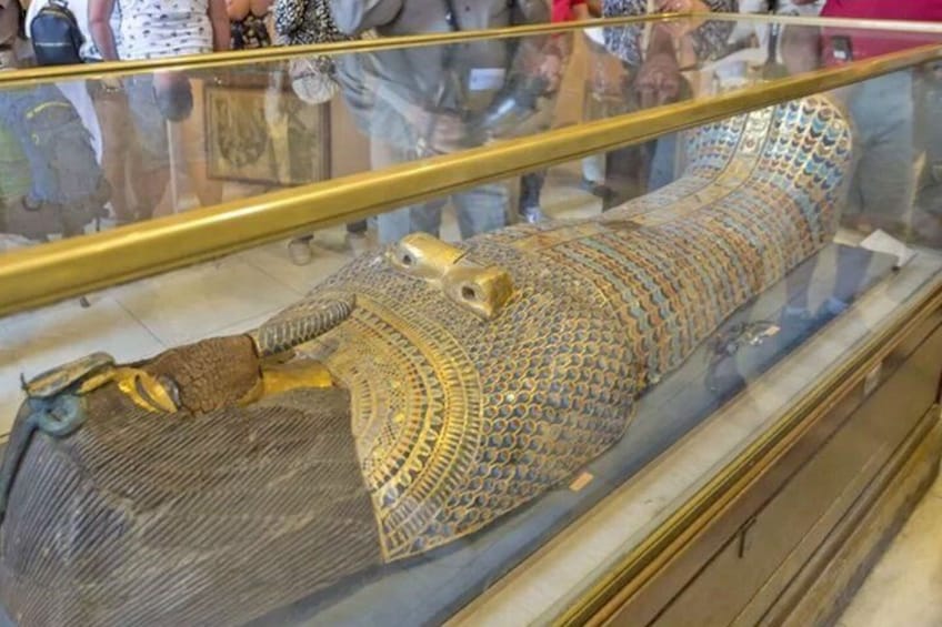 An ancient sarcophagus on display in a museum. 5