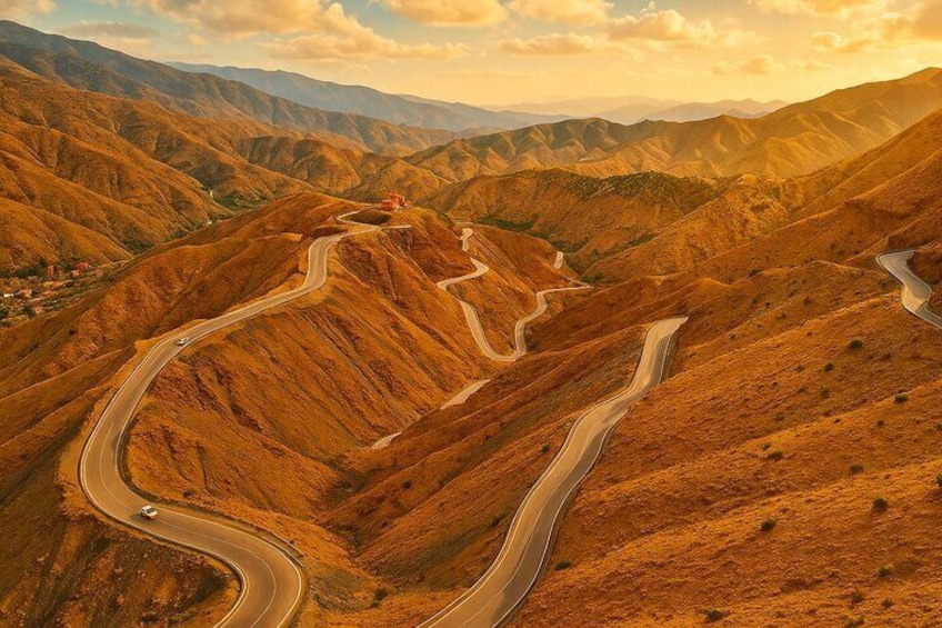 A winding mountain road with a vehicle. 5