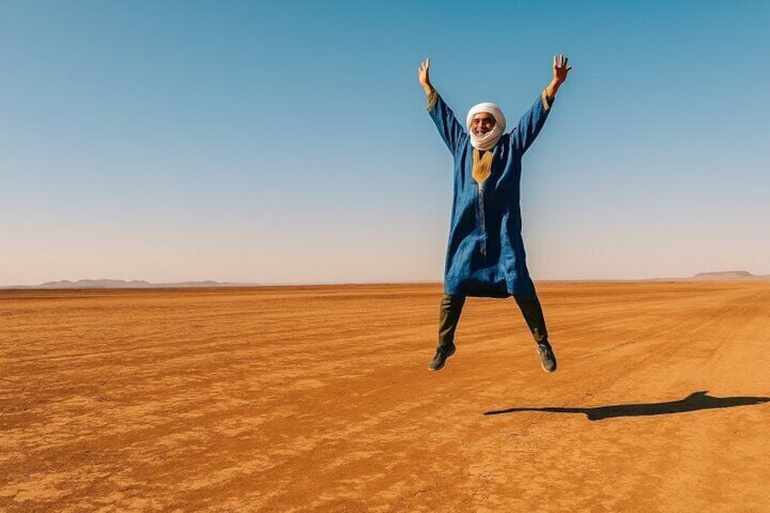A person jumping in a desert landscape. 3