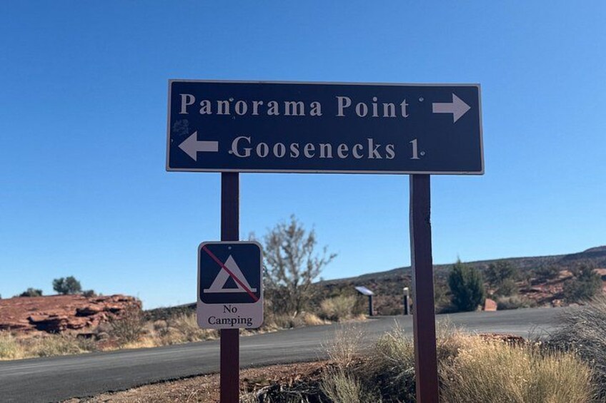 A directional sign for Panorama Point and Goosenecks 1, with a no camping sign below it. 5