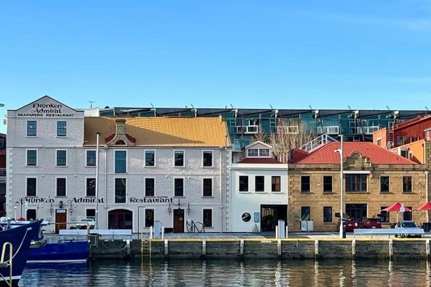 A waterfront with buildings labeled 'Drunken Admiral' and 'Restaurant.' 3