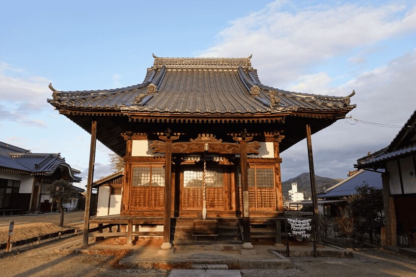 A traditional Japanese building with a tiled roof and wooden structure. 3
