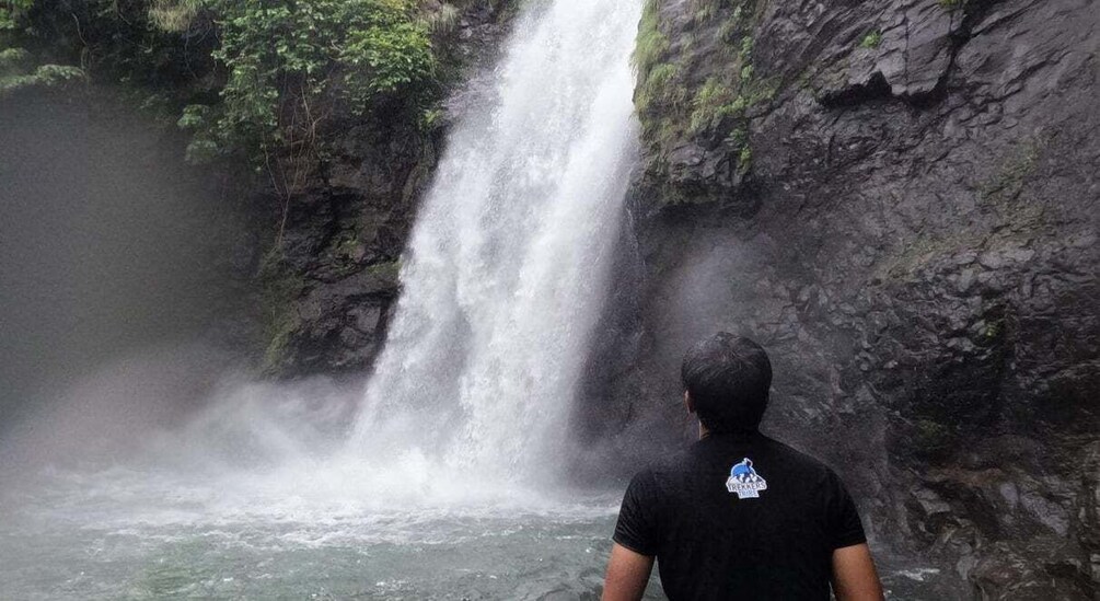 A waterfall cascading down a rocky cliff. 2