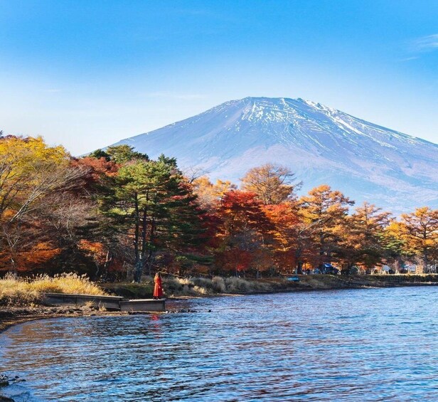 A mountain, a river, and autumn-colored trees. 4