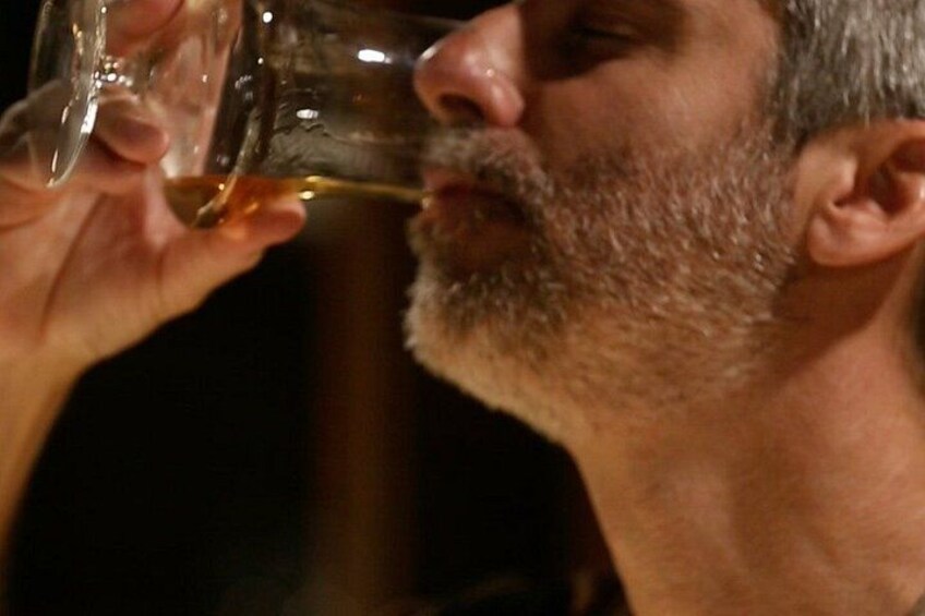 A person holding a glass of wine. 3